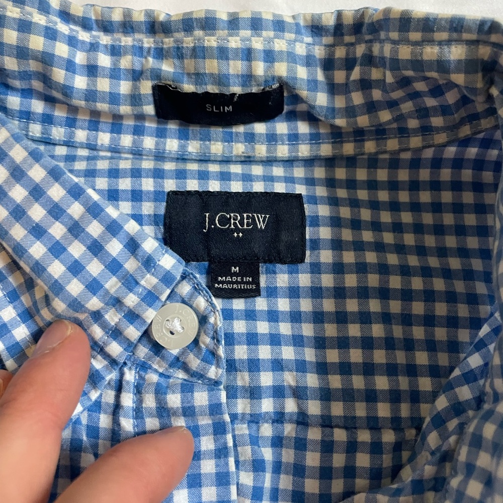 Three J crew medium shirts. Yellow, checkered blue, and yellow blue checkered.